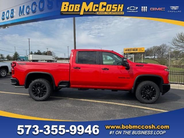2026 Chevrolet Silverado 2500 HD LT in Red Hot — front three-quarter view