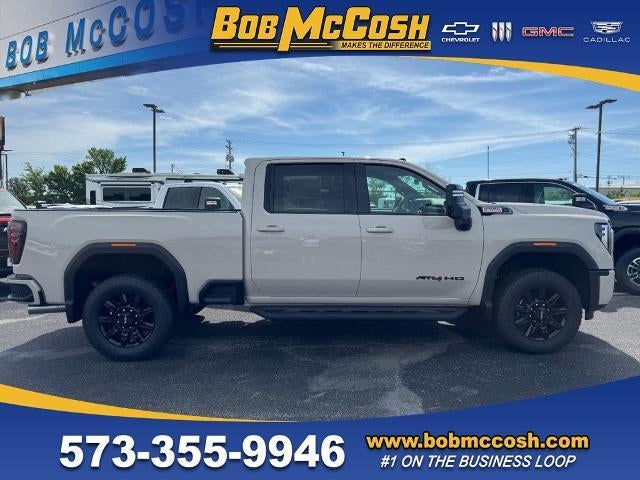 2026 GMC Sierra 2500 HD AT4 in Coastal Dune — front three-quarter view