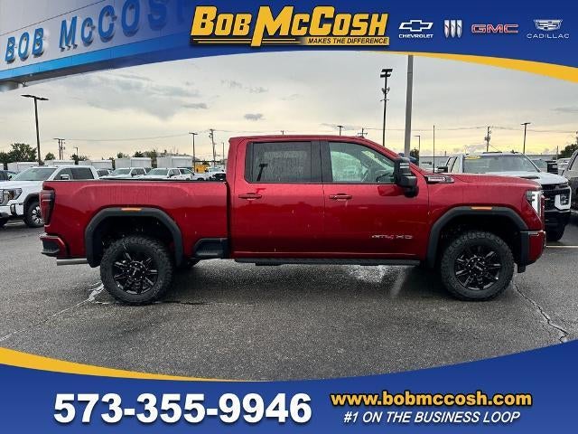 2026 GMC Sierra 2500 HD AT4 in Volcanic Red Tintcoat — front three-quarter view