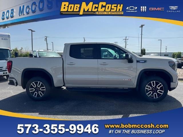 2026 GMC Sierra 1500 AT4 in Coastal Dune — front three-quarter view